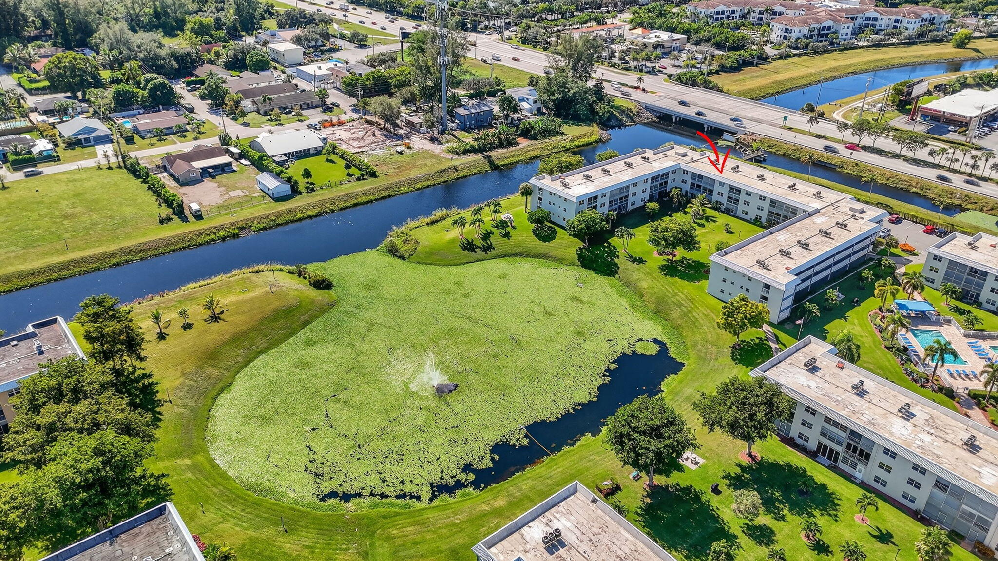 9880 Marina Boulevard, Unit 1522 Boca Raton, FL 33428 - Photo 39 of 52 an aerial view of a swimming pool and outdoor space