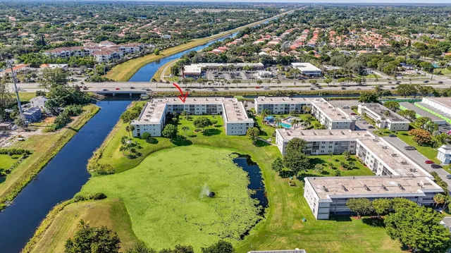 an aerial view of a swimming pool patio and mountain view