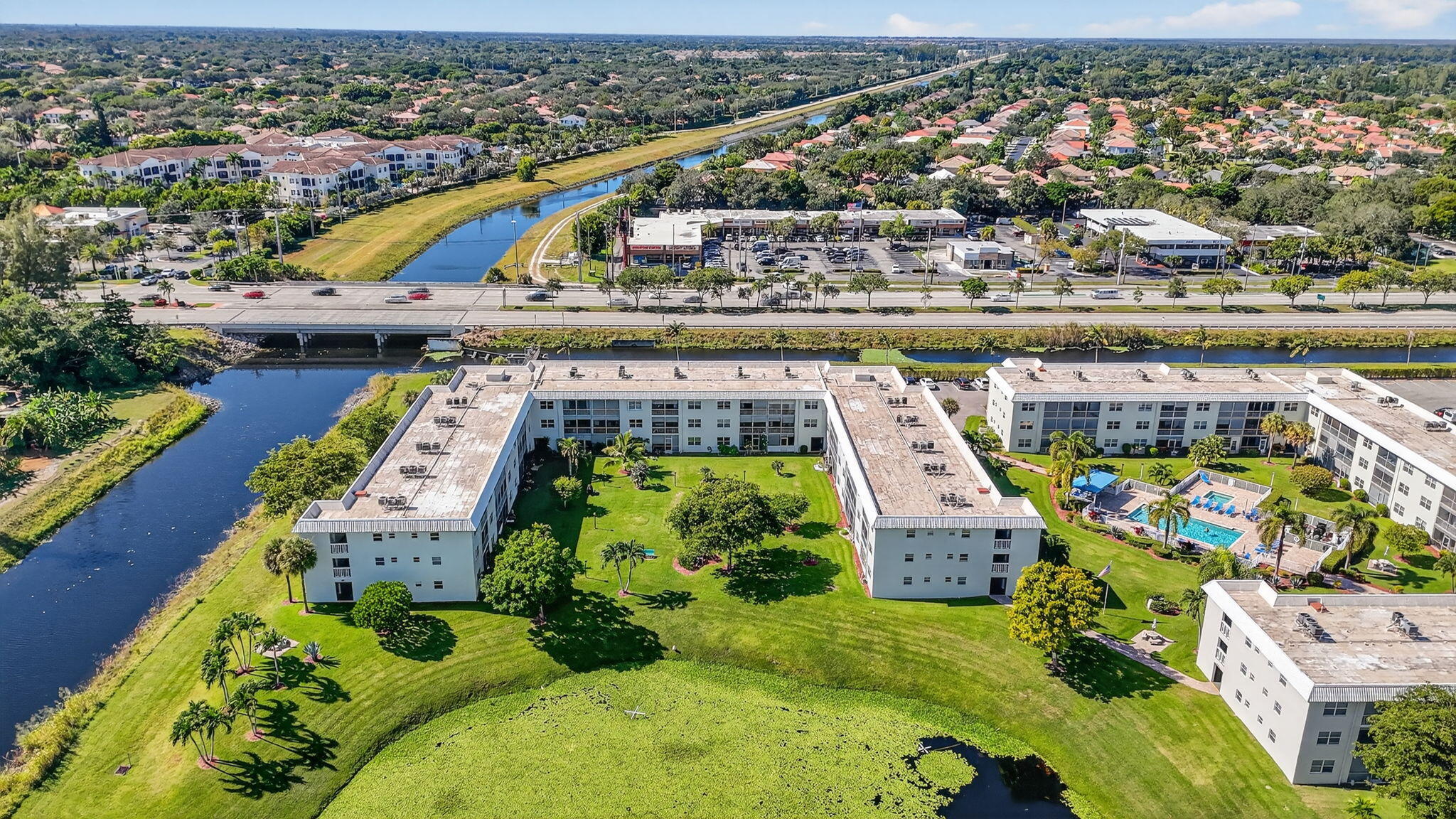 9880 Marina Boulevard, Unit 1522 Boca Raton, FL 33428 - Photo 44 of 52 an aerial view of a house with a swimming pool outdoor seating