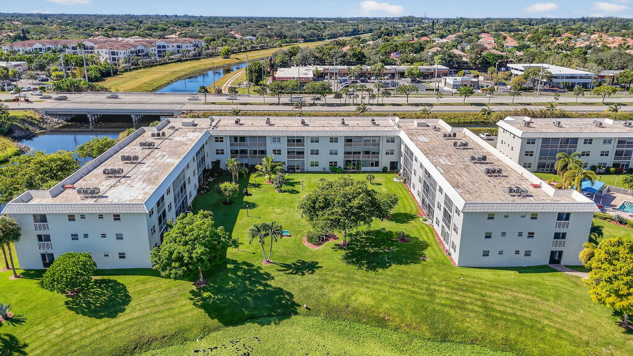 9880 Marina Boulevard, Unit 1522 Boca Raton, FL 33428 - Photo 45 of 52 an aerial view of a house with a garden