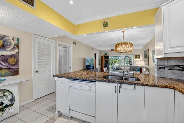 a kitchen with cabinets and window