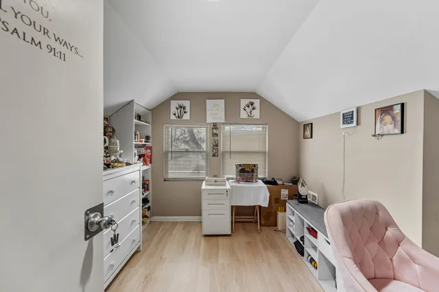 a room with furniture a rug and a window