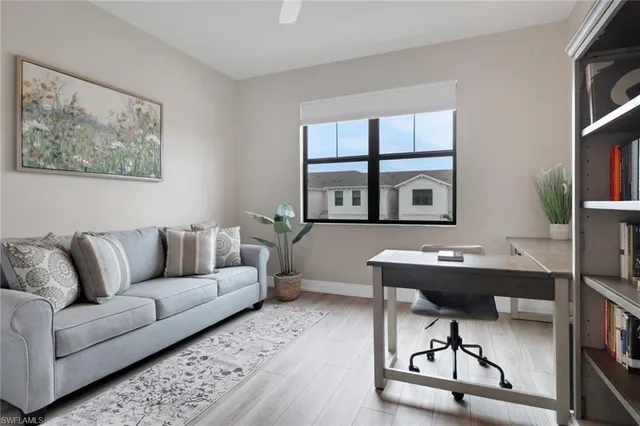 a workspace with furniture window and wooden floor