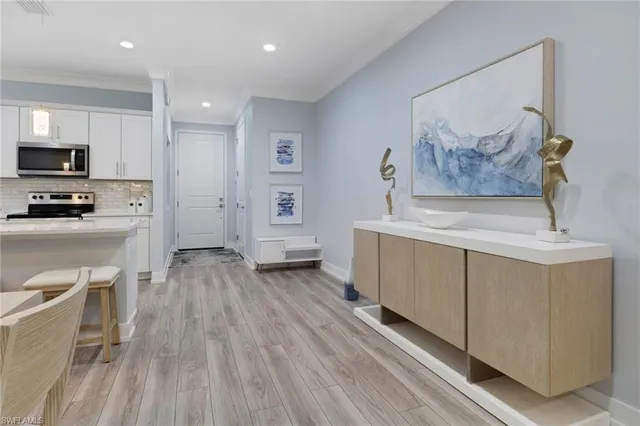 a view of kitchen with sink microwave and refrigerator