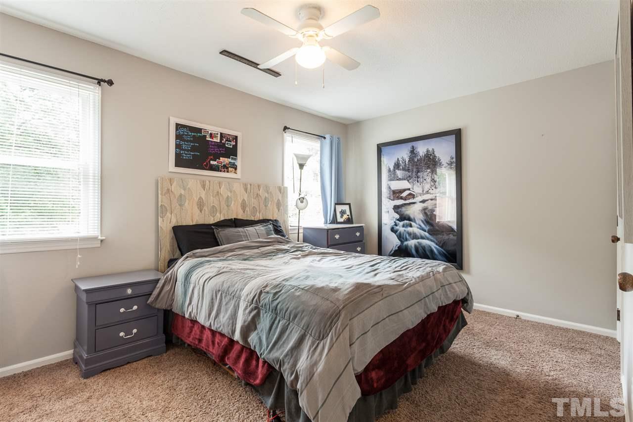 337 East Millbrook Road Raleigh, NC 27609 - Photo 11 of 30 a bedroom with a bed and a window