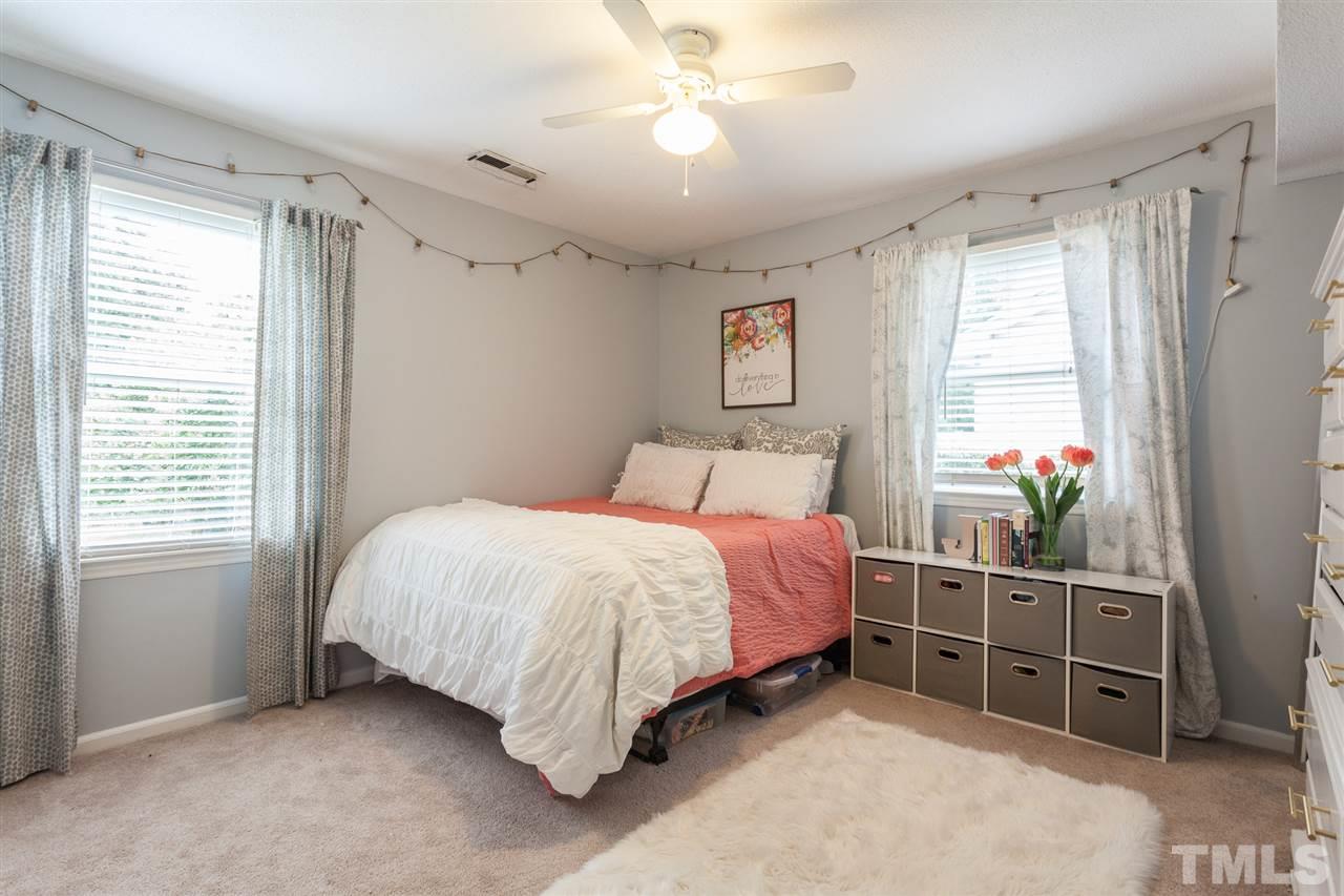 337 East Millbrook Road Raleigh, NC 27609 - Photo 20 of 30 a bedroom with a bed and a window