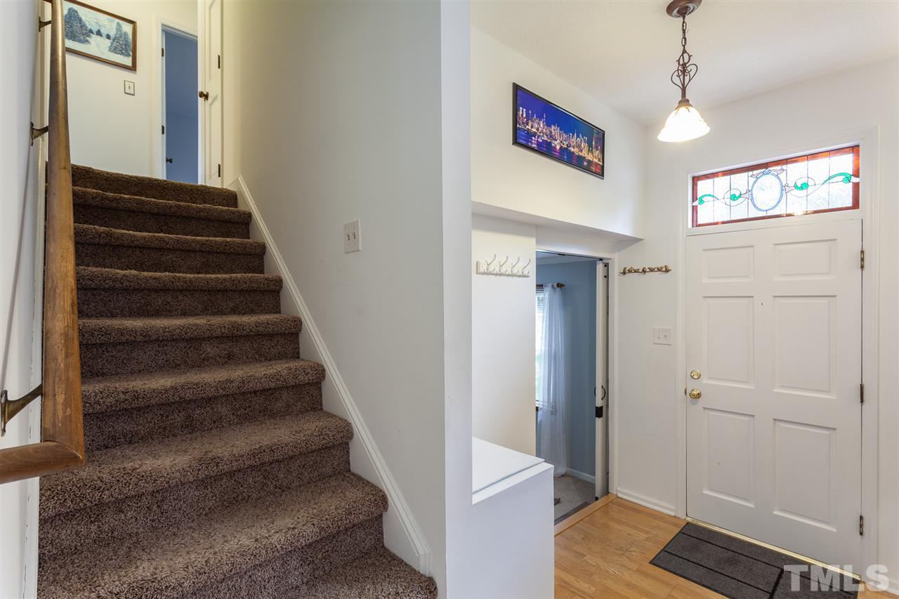 337 East Millbrook Road Raleigh, NC 27609 - Photo 10 of 30 a view of a hallway with wooden floor and entryway