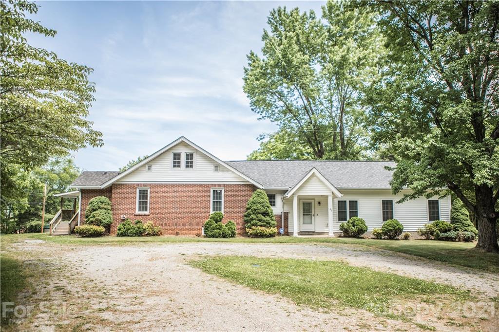 28 Mingus Hill Road Canton, NC 28716 - Photo 1 of 1 a front view of a house with a yard and garage
