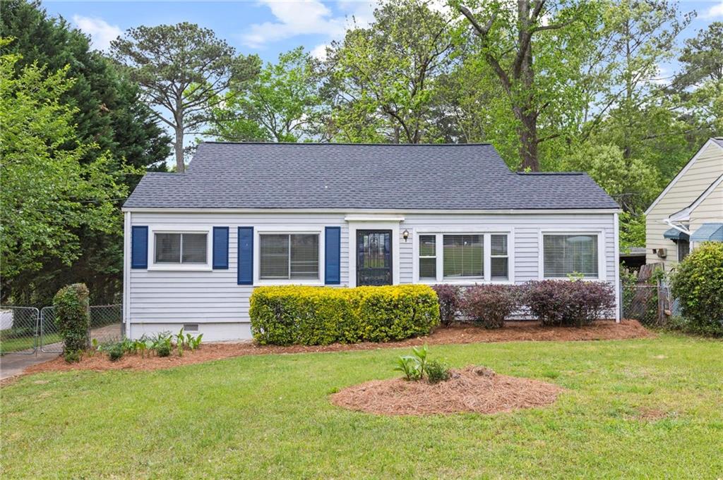 a front view of a house with a yard and porch