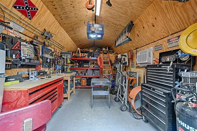 a view of backyard with furniture and a cabin