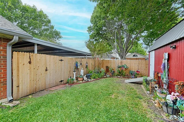 a front view of house with yard and trees