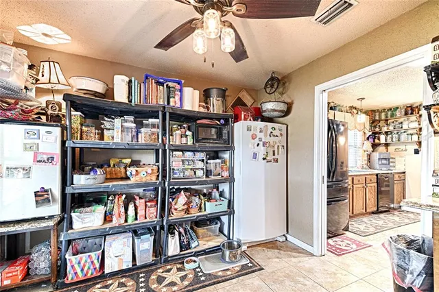 a bathroom with a glass shower door and a window
