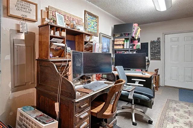a store room with lots of wooden furniture and a windows