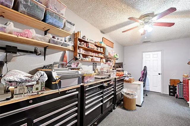 a room with lots of different colored cloths