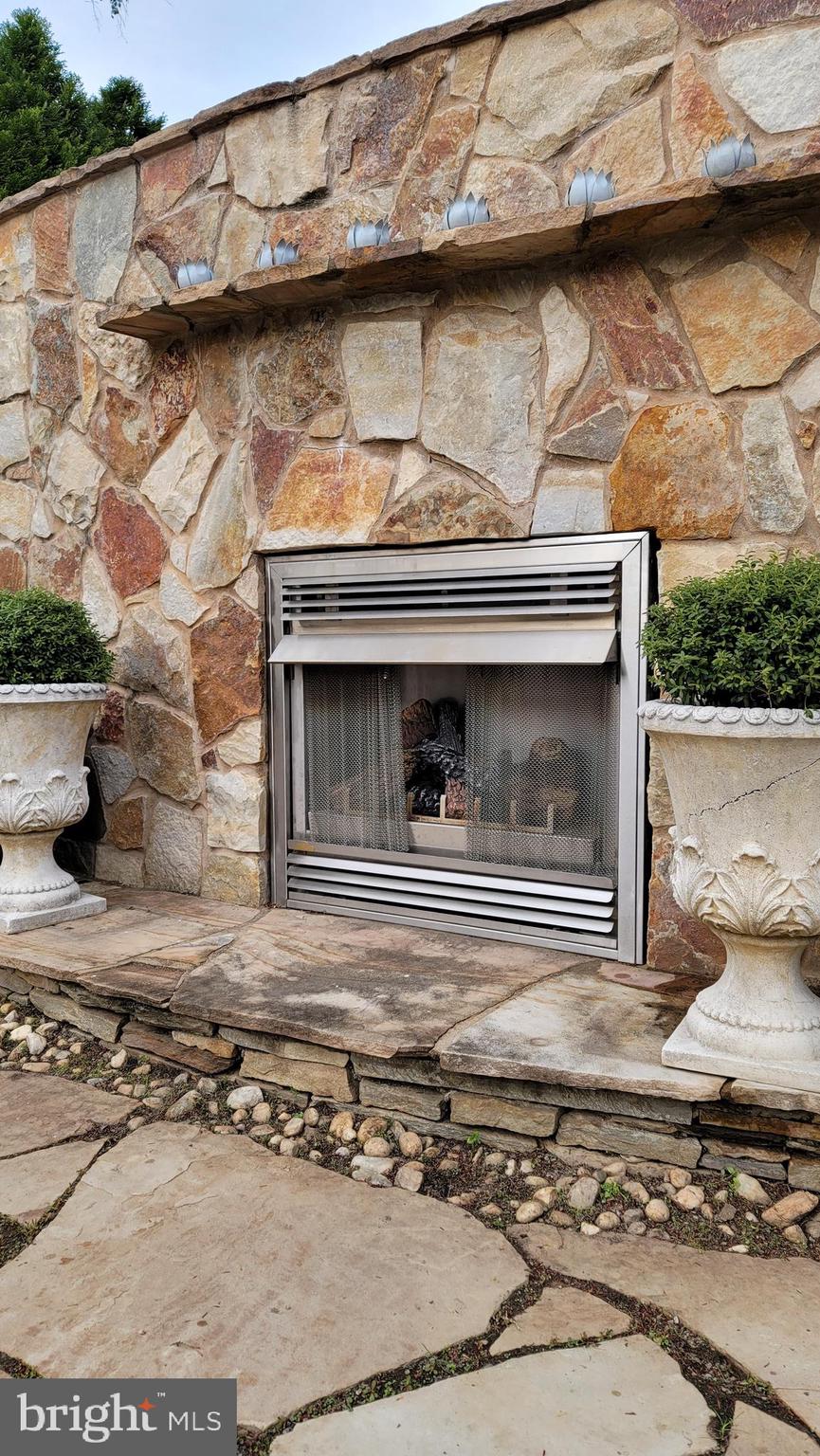 209 Whitestone Road Silver Spring, MD 20901 - Photo 46 of 57 Outdoor stone fireplace feature