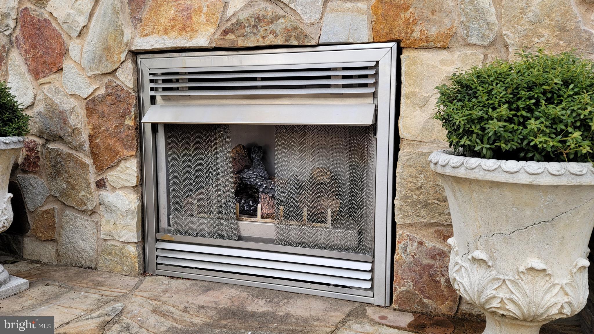 209 Whitestone Road Silver Spring, MD 20901 - Photo 47 of 57 Outdoor stone fireplace feature