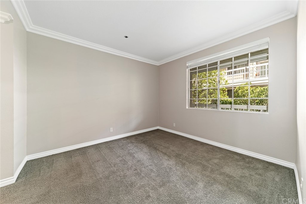 20301 Bluffside Circle, Unit 304 Huntington Beach, CA 92646 - Photo 29 of 40 an empty room with a window