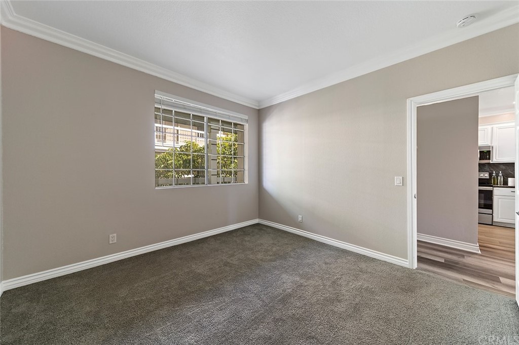 20301 Bluffside Circle, Unit 304 Huntington Beach, CA 92646 - Photo 32 of 40 an empty room with windows