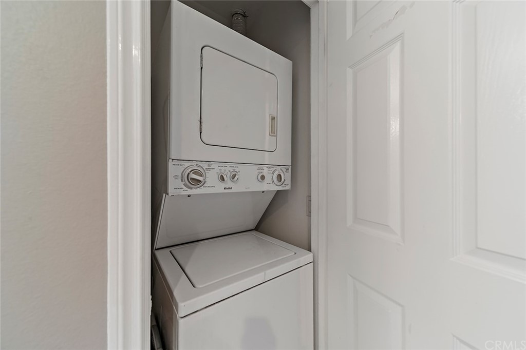 20301 Bluffside Circle, Unit 304 Huntington Beach, CA 92646 - Photo 33 of 40 a utility room with dryer and washer