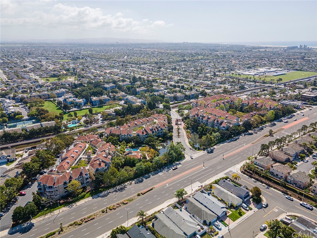 20301 Bluffside Circle, Unit 304 Huntington Beach, CA 92646 - Photo 35 of 40 an aerial view of a city with lots of residential buildings