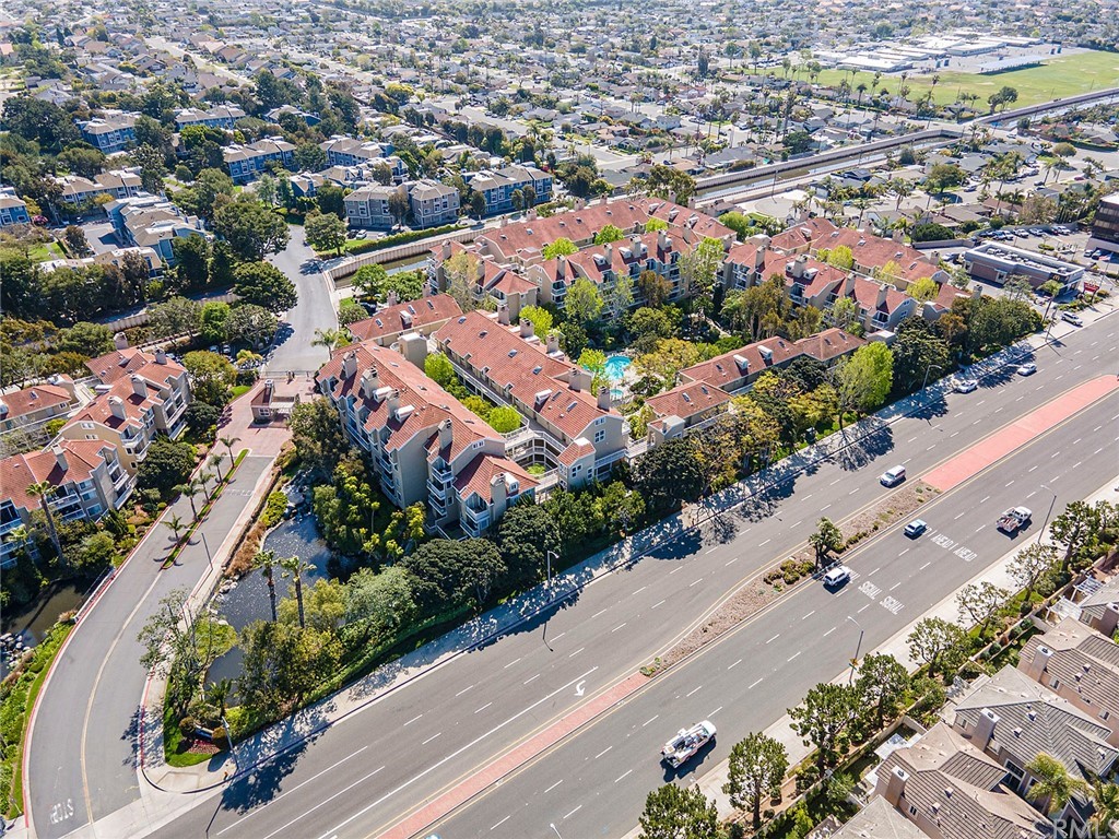 20301 Bluffside Circle, Unit 304 Huntington Beach, CA 92646 - Photo 37 of 40 an aerial view of a city with lots of residential buildings