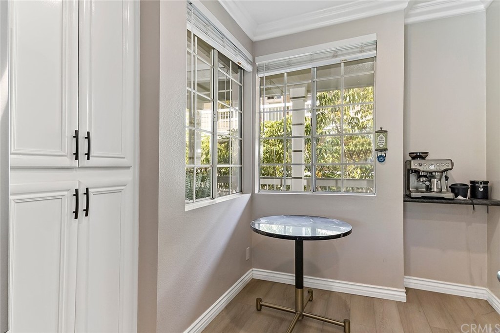 20301 Bluffside Circle, Unit 304 Huntington Beach, CA 92646 - Photo 9 of 40 a bathroom with a toilet a sink and a window