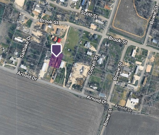 7 Brook Street Bartlett, TX 76511 - Photo 2 of 2 a street sign on a wall next to a road