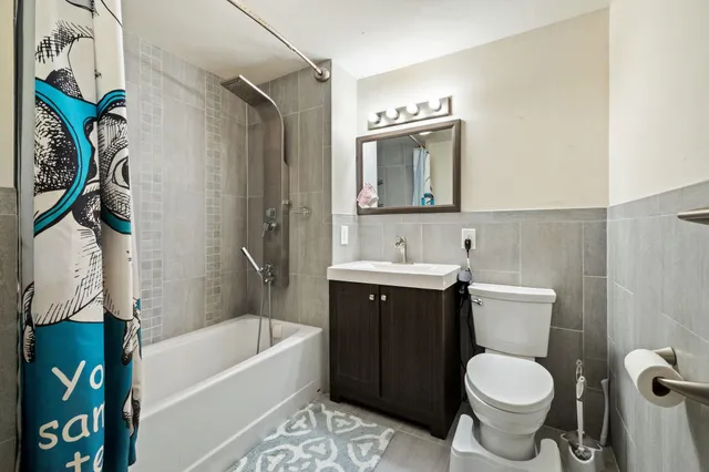 a bathroom with a sink toilet and bathtub