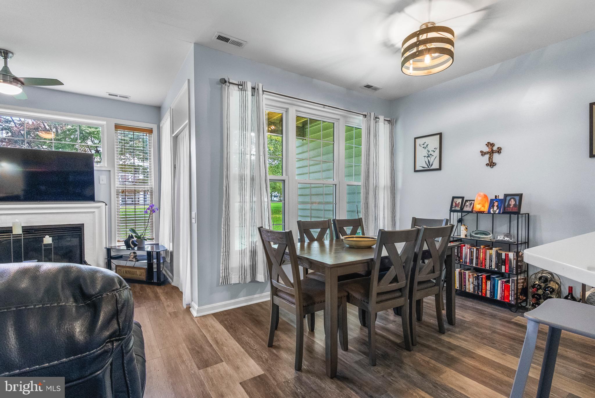 142 Rosebay Court Delran, NJ 08075 - Photo 5 of 13 a view of a dining room with furniture window and wooden floor