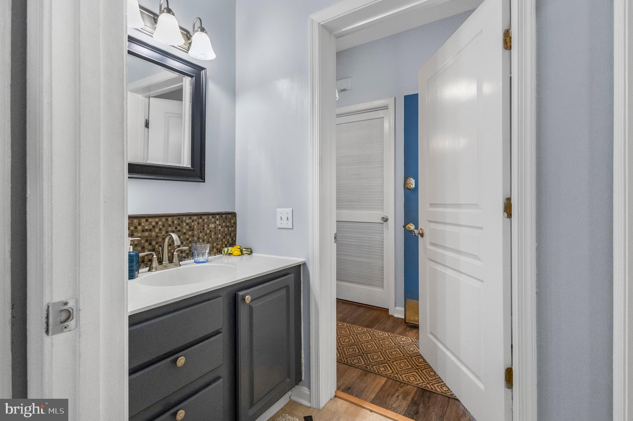 142 Rosebay Court Delran, NJ 08075 - Photo 9 of 13 a room that has a mirror and a sink