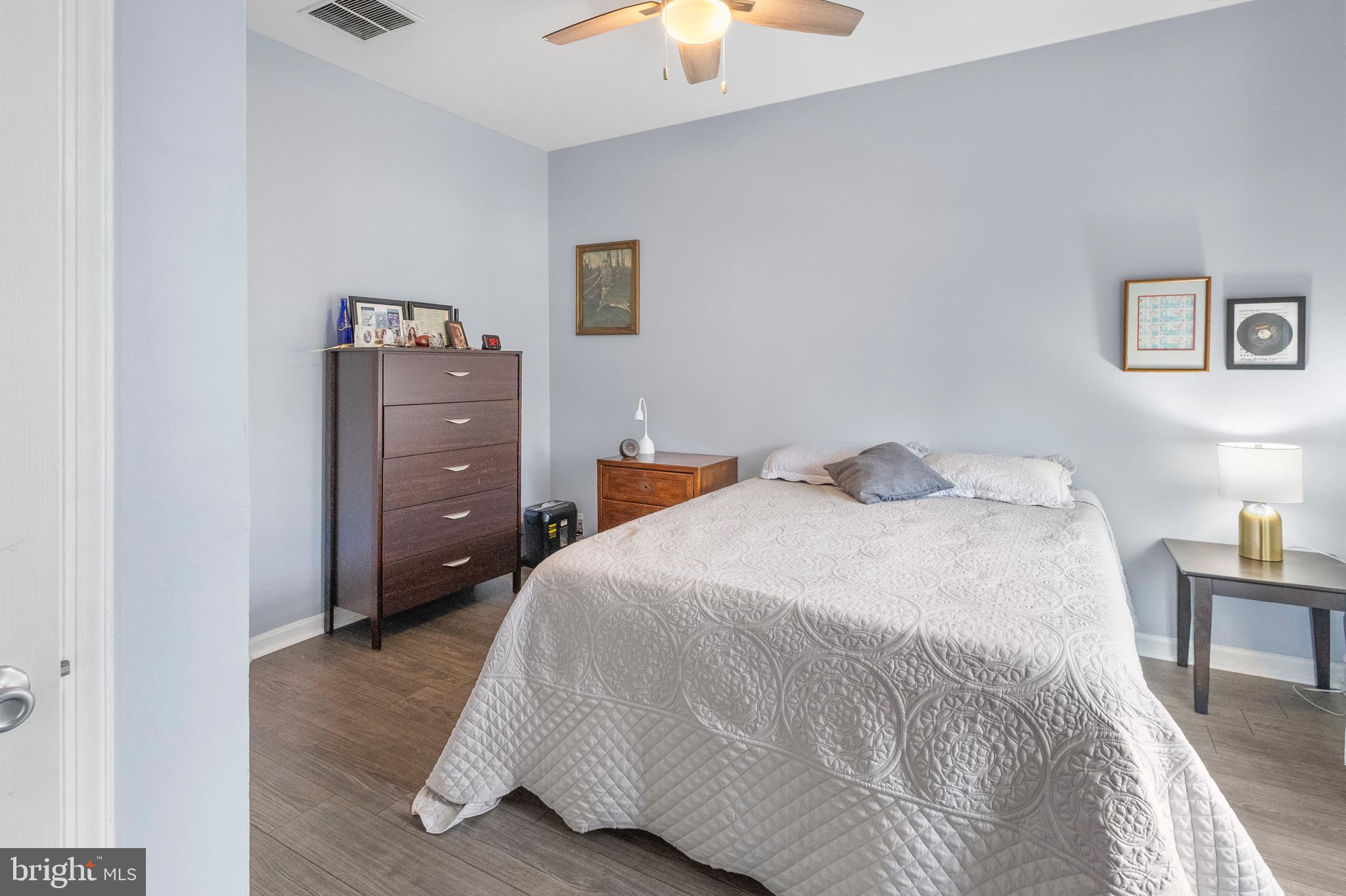 142 Rosebay Court Delran, NJ 08075 - Photo 10 of 13 a bedroom with a bed and a chandelier fan