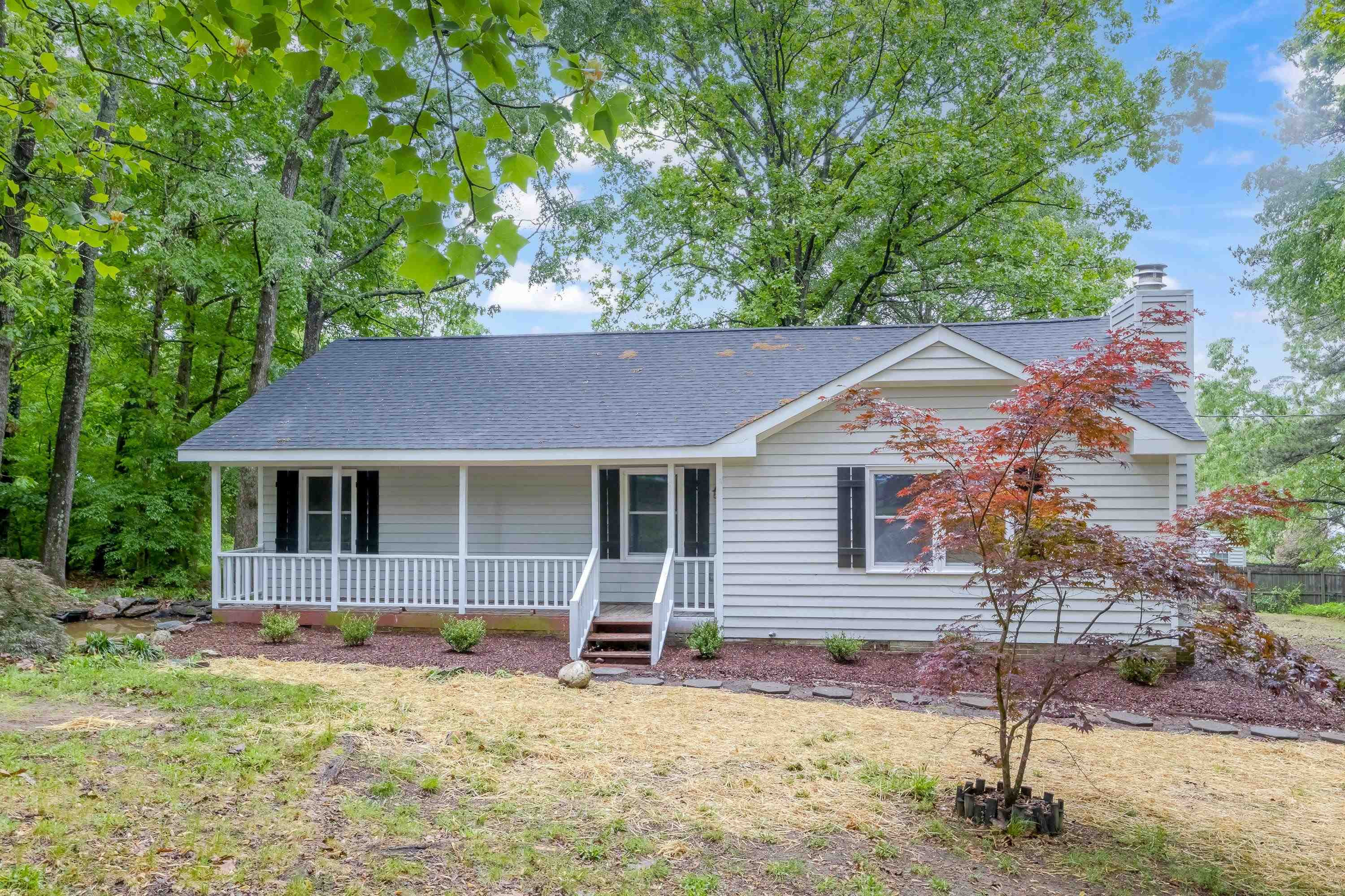 5404 Pear Orchard Lane Raleigh, NC 27616 - Photo 1 of 22 a house that has a tree in front of it