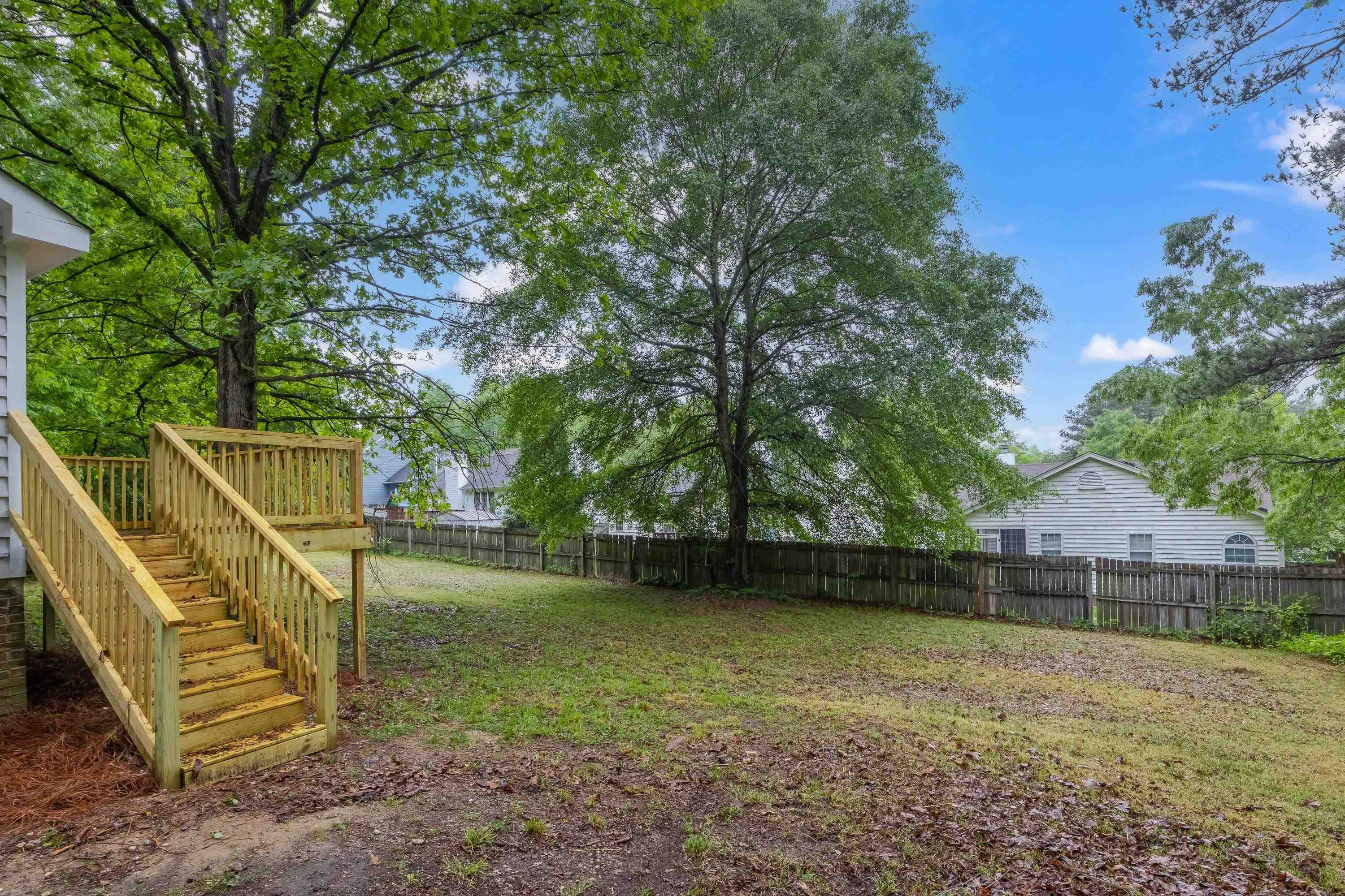 5404 Pear Orchard Lane Raleigh, NC 27616 - Photo 18 of 22 a view of a house with a backyard
