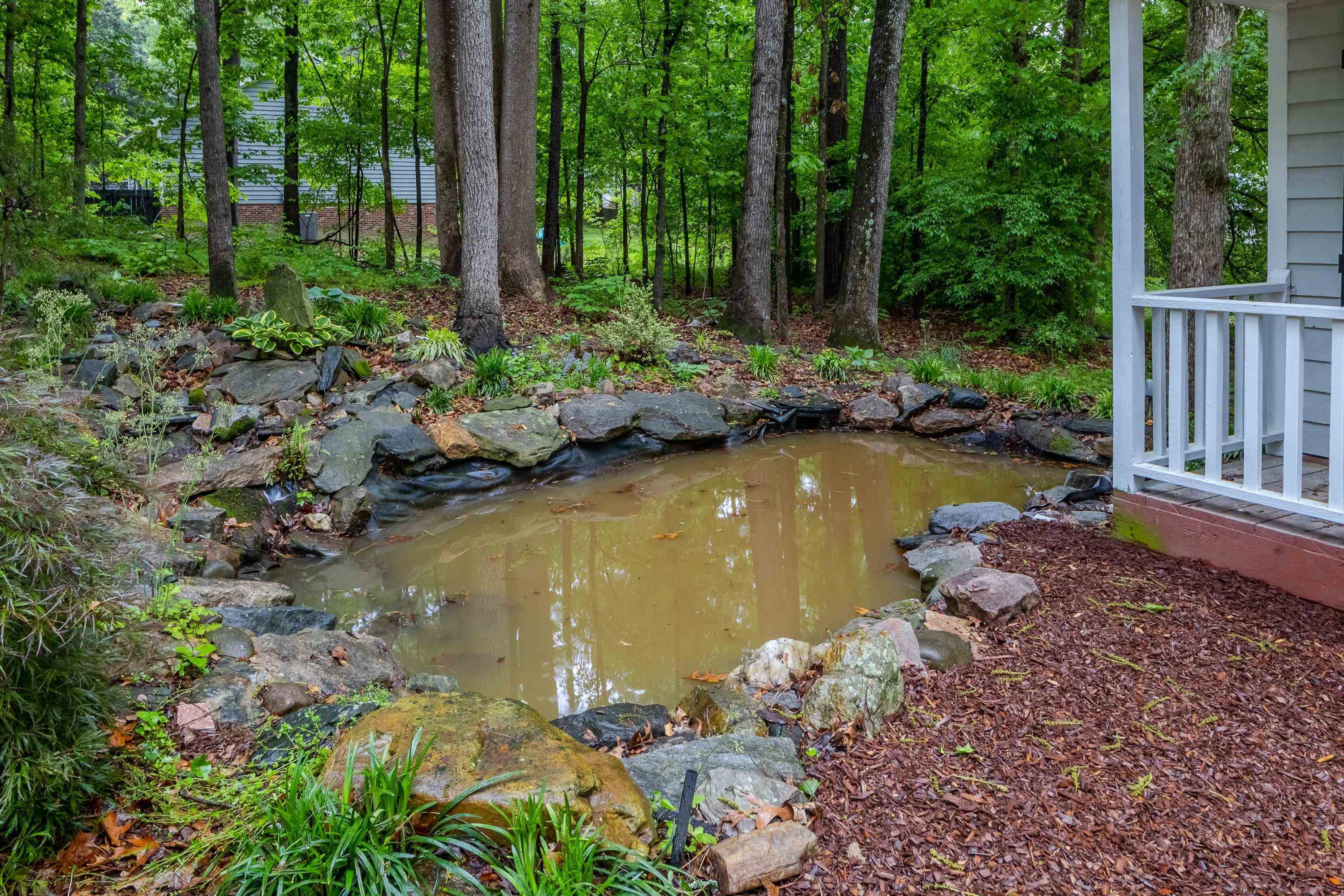 5404 Pear Orchard Lane Raleigh, NC 27616 - Photo 19 of 22 a view of a lake with a house