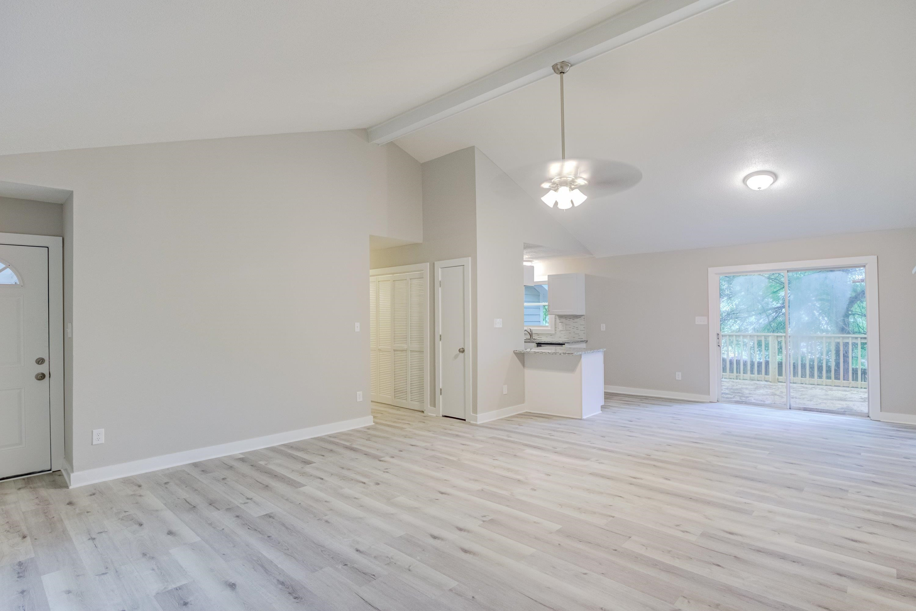 5404 Pear Orchard Lane Raleigh, NC 27616 - Photo 5 of 22 wooden floor in an empty room with a window