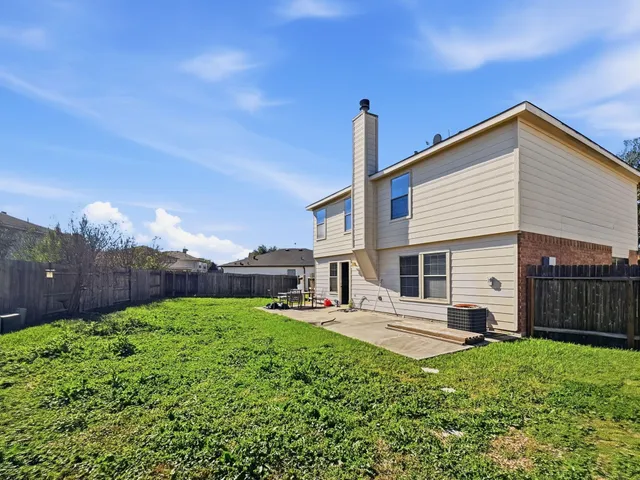 a house view with a garden space