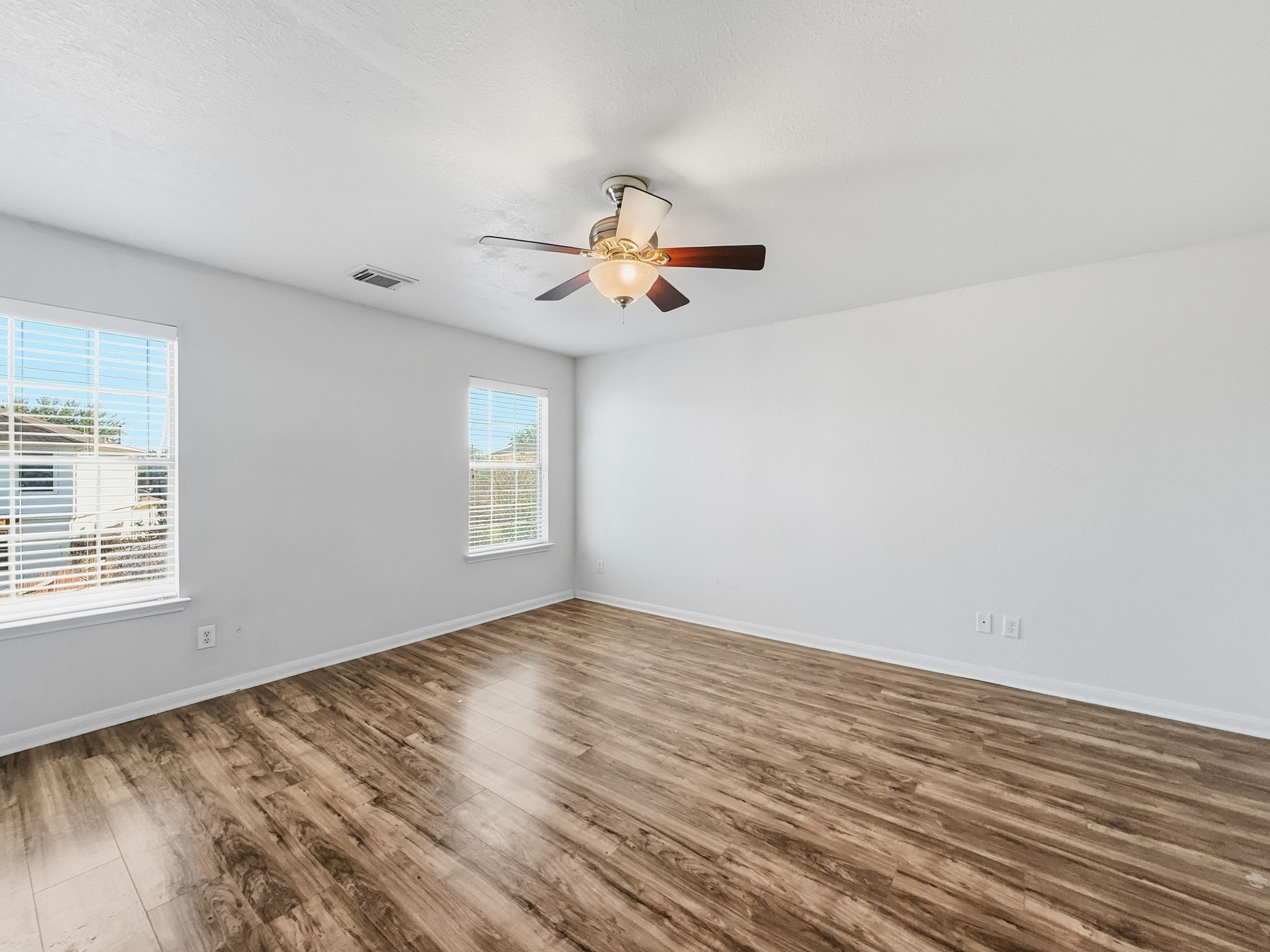 29502 Legends Pine Lane Spring, TX 77386 - Photo 8 of 15 wooden floor in an empty room with a window