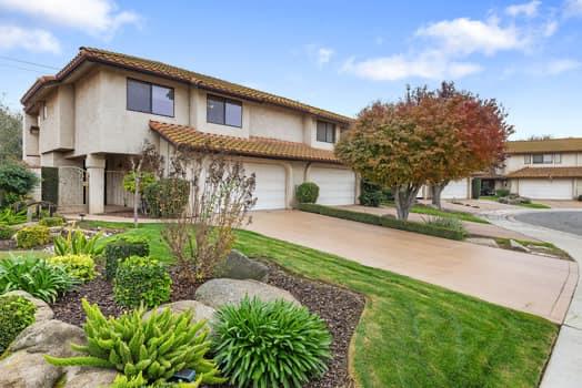 913 Valley Way Madera, CA 93637 - Photo 1 of 39 a front view of a house with garden