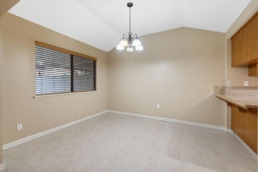 913 Valley Way Madera, CA 93637 - Photo 11 of 39 a view of an empty room with a window