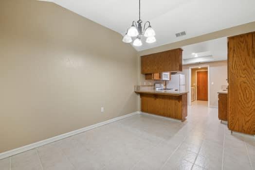 913 Valley Way Madera, CA 93637 - Photo 12 of 39 a view of open kitchen with granite countertop cabinets a sink and dishwasher