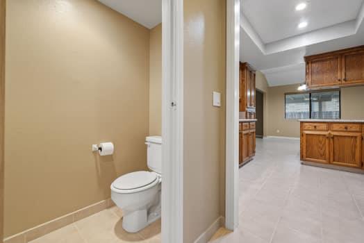 913 Valley Way Madera, CA 93637 - Photo 19 of 39 a bathroom with a toilet and a sink