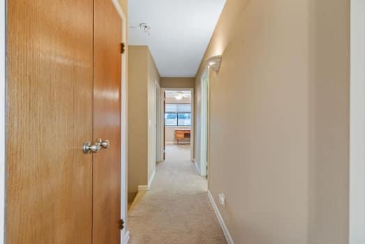 913 Valley Way Madera, CA 93637 - Photo 22 of 39 a view of a hallway with wooden shelves