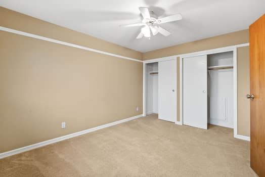 913 Valley Way Madera, CA 93637 - Photo 24 of 39 an empty room with a ceiling fan and a window