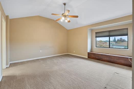 913 Valley Way Madera, CA 93637 - Photo 28 of 39 an empty room with windows and ceiling fan