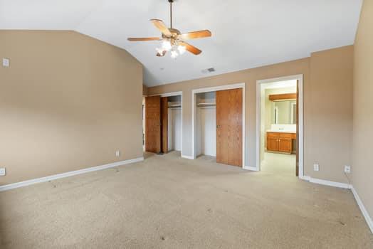 913 Valley Way Madera, CA 93637 - Photo 29 of 39 an empty room with chandelier fan and windows