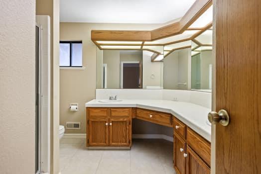 913 Valley Way Madera, CA 93637 - Photo 30 of 39 a bathroom with a sink and mirror