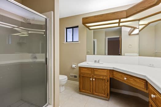 913 Valley Way Madera, CA 93637 - Photo 31 of 39 a bathroom with a sink a toilet and shower