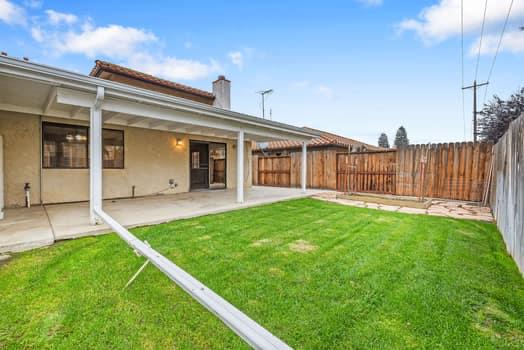 913 Valley Way Madera, CA 93637 - Photo 36 of 39 a view of a house with a backyard