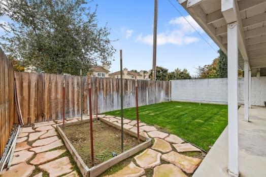 913 Valley Way Madera, CA 93637 - Photo 37 of 39 a view of a backyard with sitting area