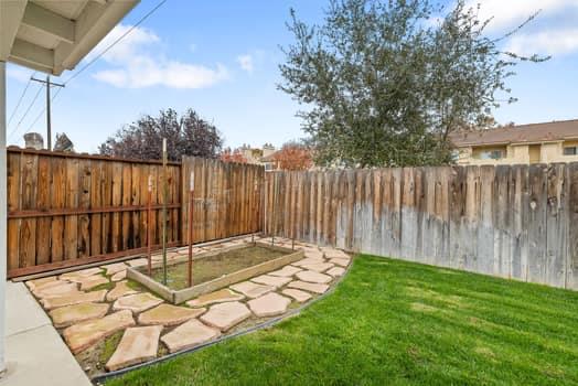 913 Valley Way Madera, CA 93637 - Photo 38 of 39 a view of a backyard with wooden fence